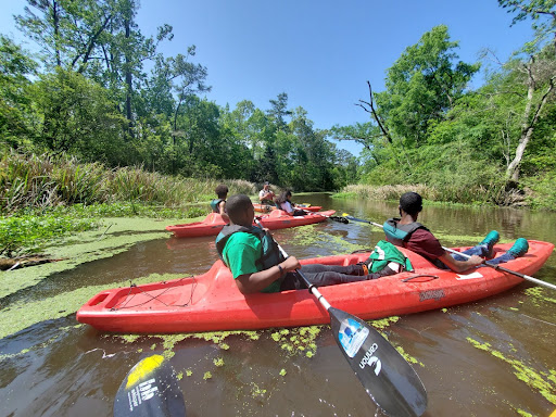 Students in kayaks on bayou