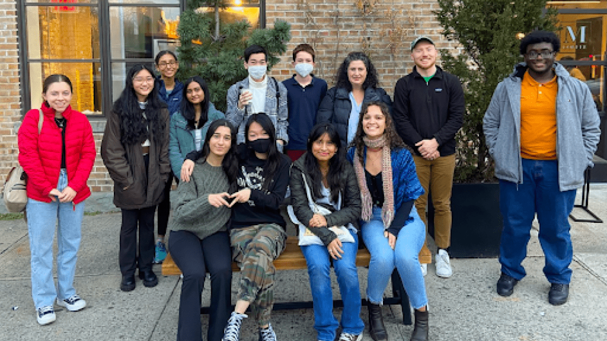 Group of students smile for the camera