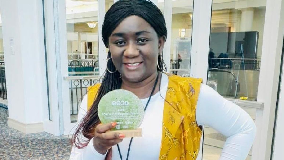 Photo of Mariam Kabamba smiling while holding an award