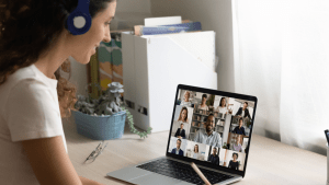 young women with headphones on zoom conference call