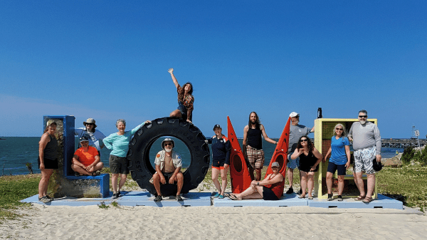 Certification Candidates at Virginia Love Sign on Beach