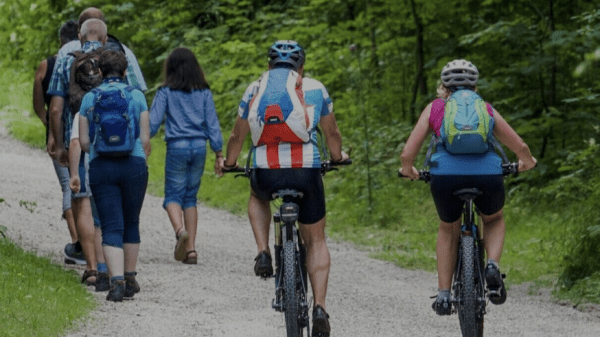 People walking and riding bikes on a trail