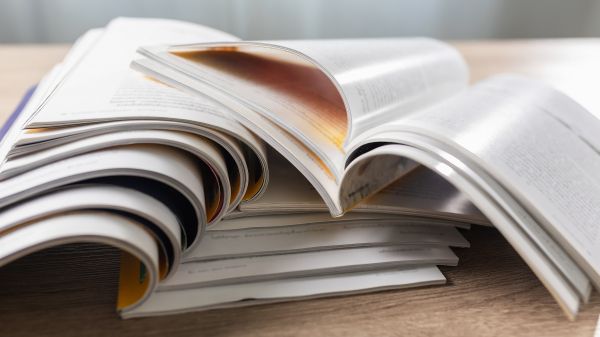 Stack of magazines on a desk
