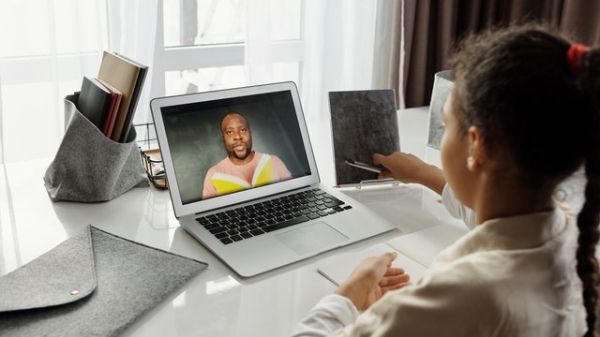 Little girl takes an online class