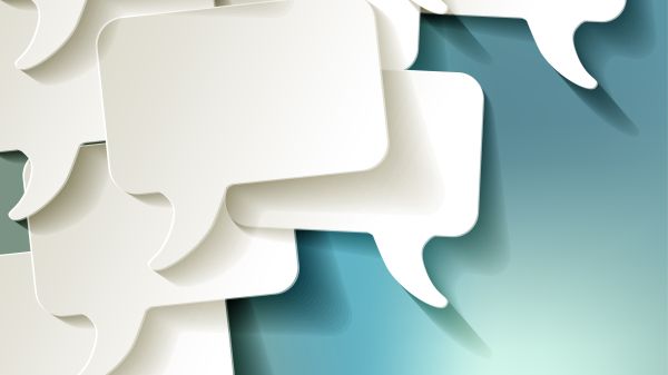 Chat speech bubbles vector white on blue bokeh background