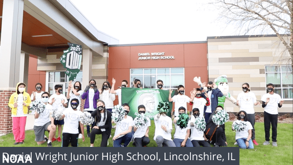 A group of students cheering outside in front of a school. White text at the bottom reads Daniel Wright Junior High School, Lincolnshire, IL