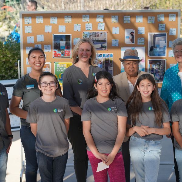 Jenna Hoover, William Mercado, youth cohort members, CBWCD General Manager Elizabeth Skrzat, CBWCD Board Member Dr. Hanif Gulmahamad, and CBWCD Board Vice President Margaret Hamilton gather to celebrate the CBWD Open House and Student Showcase. 