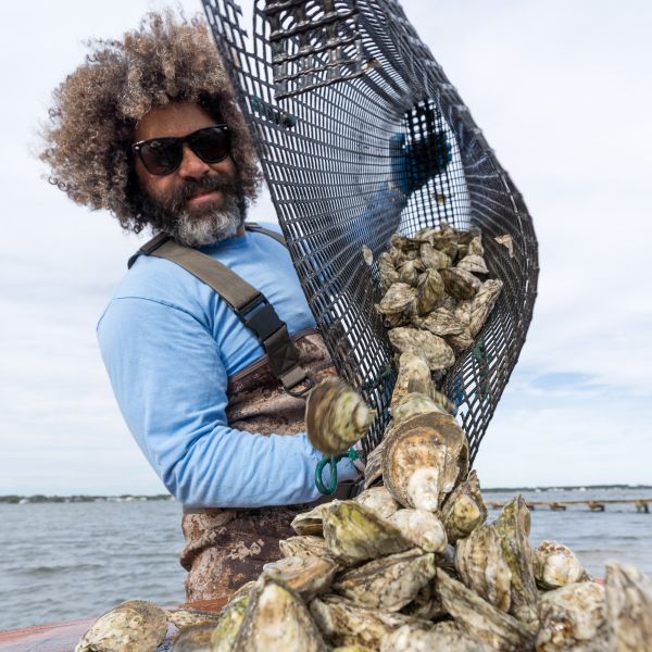 Ryan Bethea of Oysters Carolina empties a bag full of tasty oysters from his farm.